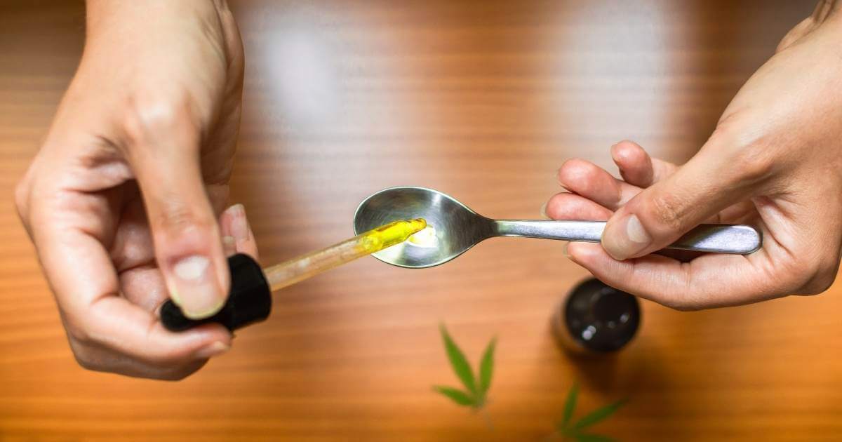 CBD oil on spoon over a table