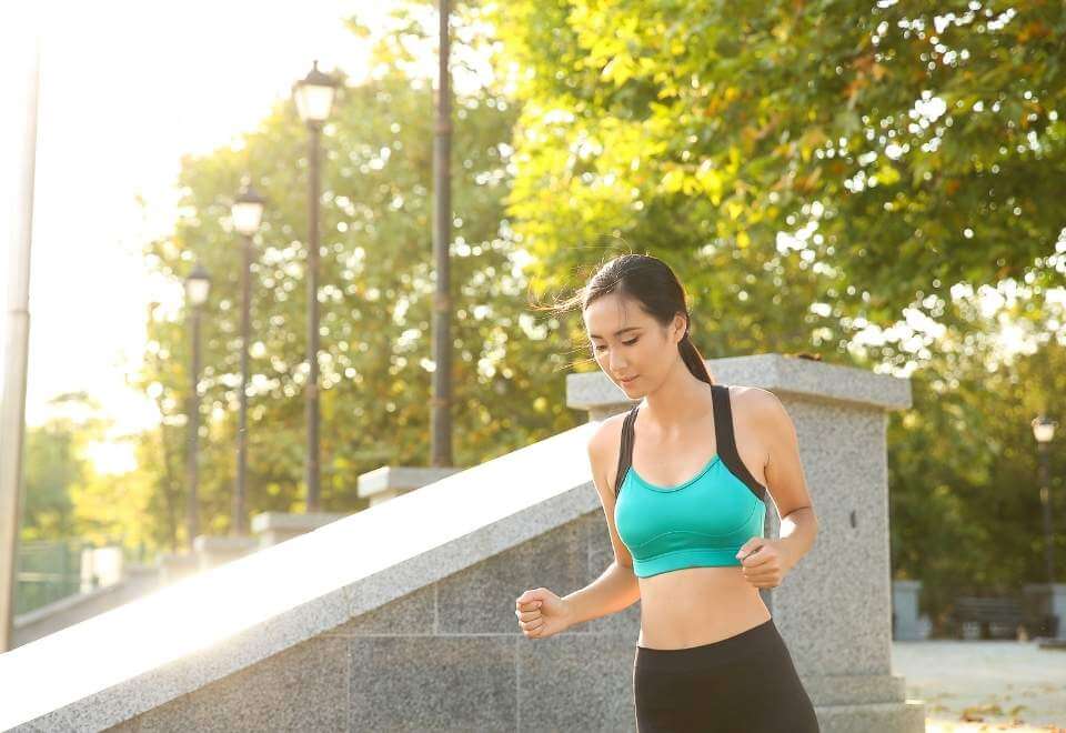 Woman in green sporting clothing