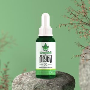 Hemp seed oil bottle on stone with green background
